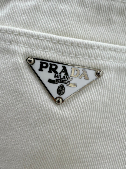 White jeans with classic triangle logo