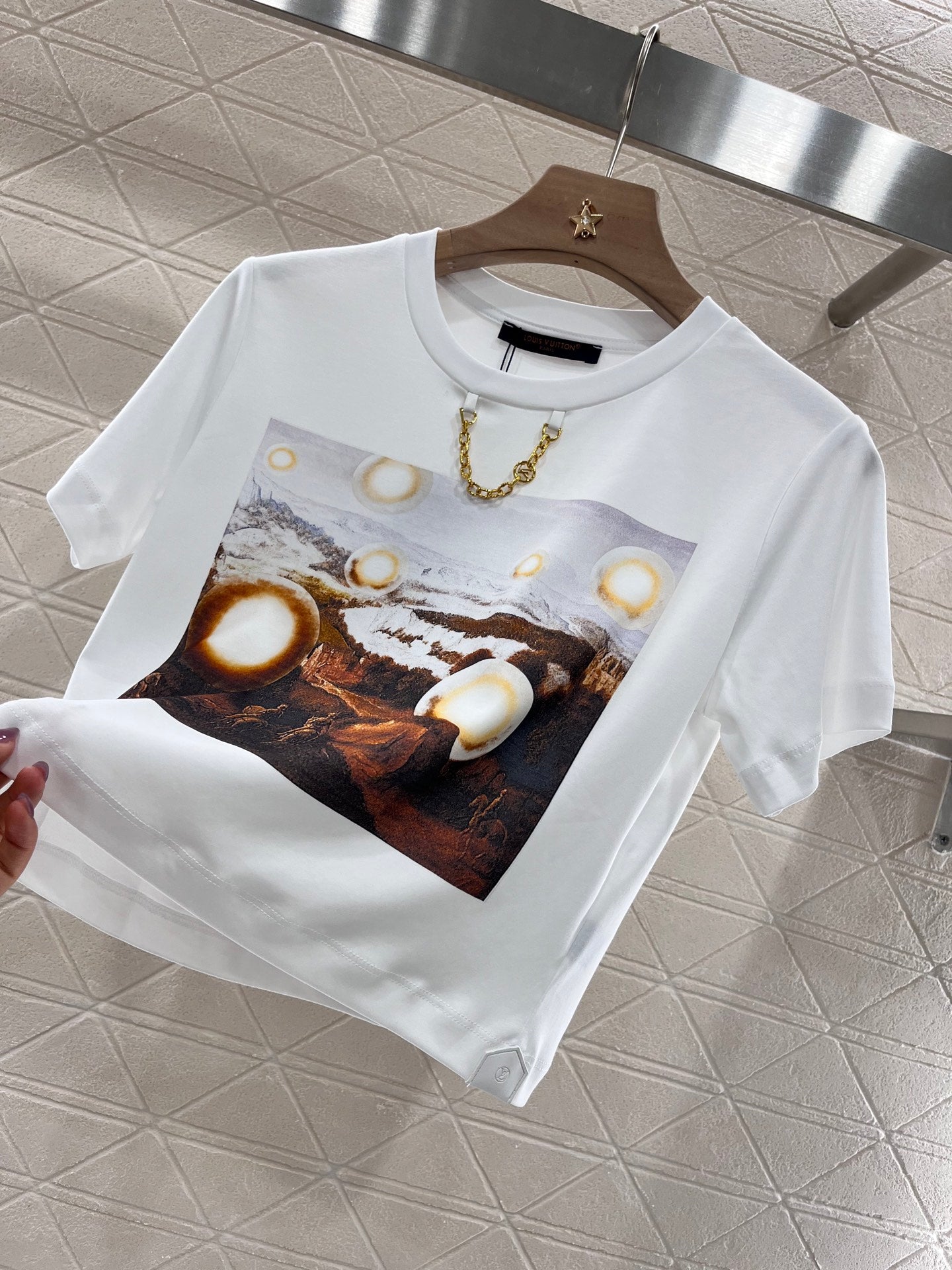 New product promotion. Walking on the street in a fashionable white T-shirt. Beautiful heart!